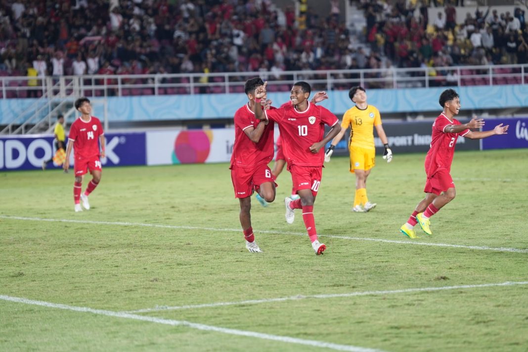 Timnas Indonesia U-16 melakukan start manis di laga perdana grup A, ASEAN U-16 Boys Championship 2024. Garuda Muda mampu mengalahkan Singapura 3-0 di Stadion Manahan, Solo, Jumat (21/6/2024). (Dok/PSSI)