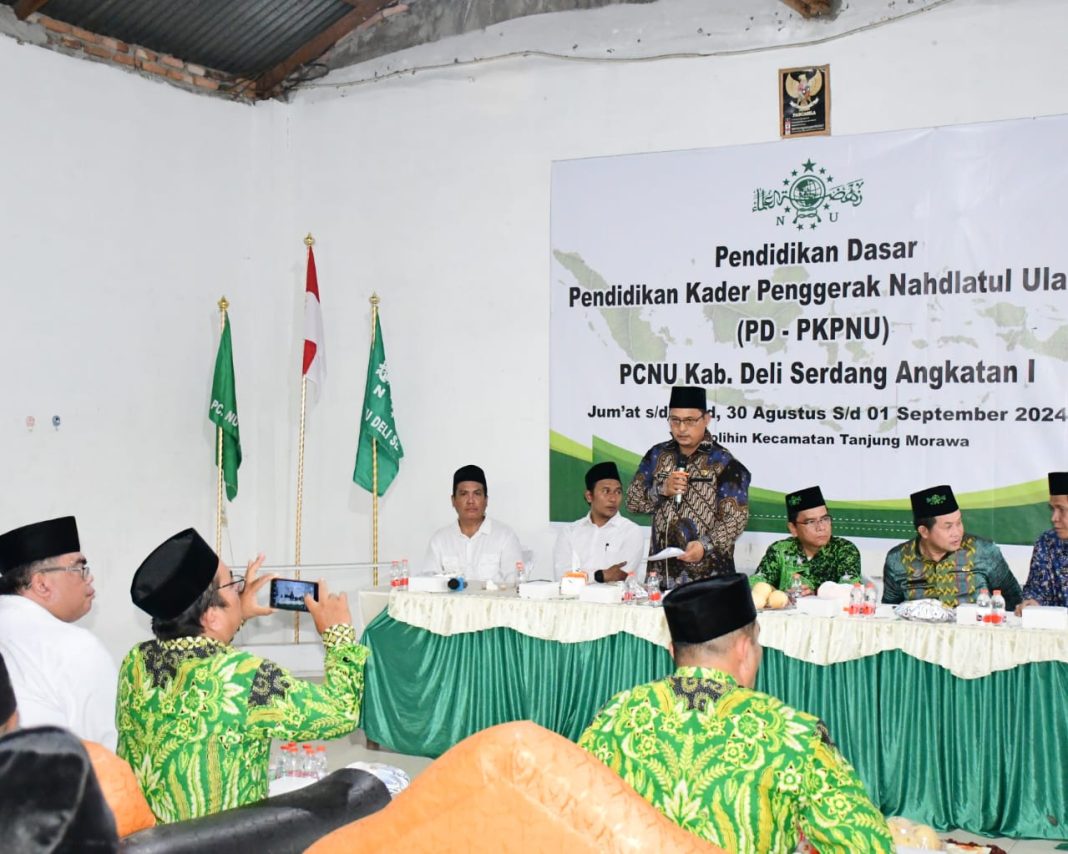 Pj Sekda Deliserdang Citra E Capah menyampaikan sambutan pada PD-PKKPNU Angkatan 1 PCNU Deliserdang di Tanjungmorawa, Jumat (30/8/2024). (Dok/Kominfo Deliserdang)