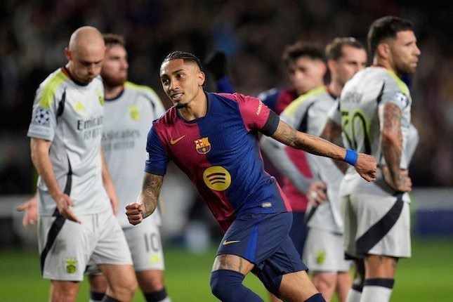 Selebrasi Raphinha dalam laga Liga Champions antara Barcelona vs Benfica, Rabu (12/3/2025).